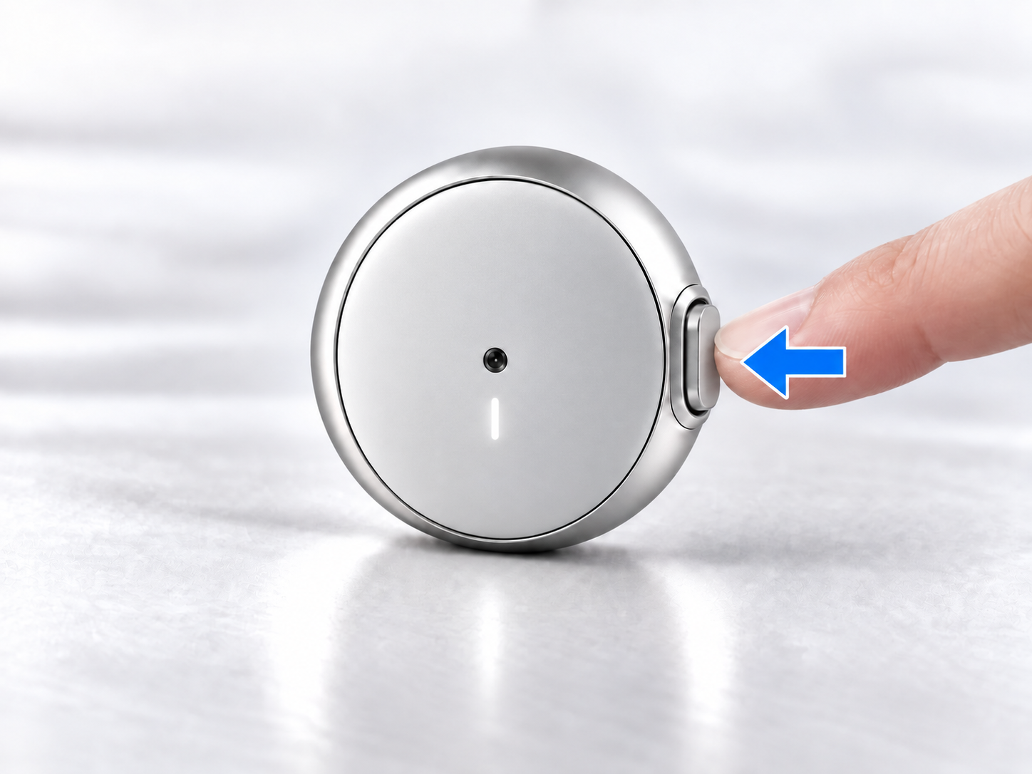 A finger pressing the rounded metal Prana clip inward
